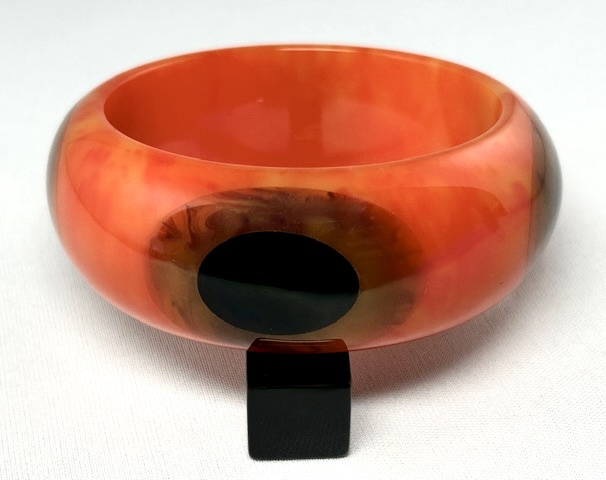 SZ25 Shultz orange bakelite bangle/double oval dots